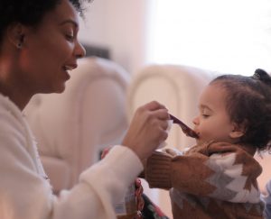 Baby being fed by her mommy